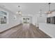 Open concept living area with recessed lighting and a sliding glass door that offers backyard views at 1549 Coastal Cove Ln, Calabash, NC 28467