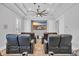 Home theater room featuring reclining seats, a large screen, and surround sound at 1549 Coastal Cove Ln, Calabash, NC 28467