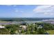 Expansive aerial view of a coastal community, showcasing a river, lush greenery, and waterfront properties at 1566 Bessent Ave., Little River, SC 29566