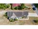 Overhead view of the house, highlighting its roof, landscaped yard, and neighborhood surroundings at 1566 Bessent Ave., Little River, SC 29566
