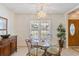 Bright dining area with a decorative chandelier, table for four, and plenty of natural light at 1566 Bessent Ave., Little River, SC 29566