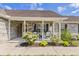 Inviting front porch with seating and decorative plants enhancing the home's curb appeal at 1566 Bessent Ave., Little River, SC 29566