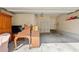 A spacious garage with ample storage space, featuring a traditional piano and a clean, organized area at 1566 Bessent Ave., Little River, SC 29566