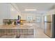 Well-equipped kitchen with stainless steel appliances and breakfast bar seating at 1566 Bessent Ave., Little River, SC 29566