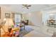 Comfortable living room with plush furnishings, ceiling fan, and views into the adjacent dining area at 1566 Bessent Ave., Little River, SC 29566