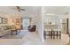 Inviting living room featuring a plush sofa, ceiling fan and adjacent kitchen area at 1566 Bessent Ave., Little River, SC 29566