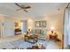 Cozy living room featuring comfortable seating, a ceiling fan, and plenty of natural light at 1566 Bessent Ave., Little River, SC 29566