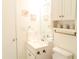 Bright bathroom with white cabinetry, a decorative mirror, and stylish fixtures at 1605 S Ocean Blvd. # 1909, Myrtle Beach, SC 29577