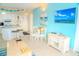 Bright condo living space with white furnishings, beach decor, and tile flooring at 1605 S Ocean Blvd. # 1909, Myrtle Beach, SC 29577