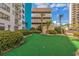 Turf area and palm trees surrounding the building at 1605 S Ocean Blvd. # 1909, Myrtle Beach, SC 29577