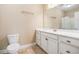 Bathroom with white vanity, faucet, mirror, toilet and towel racks at 189 Ella Kinley Circle # 201, Myrtle Beach, SC 29588