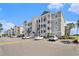 Well-maintained condo building with ample parking, manicured landscaping, and open air stairwells at 189 Ella Kinley Circle # 201, Myrtle Beach, SC 29588