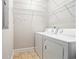 Practical laundry room with washer, dryer and wire shelving, providing convenience at 189 Ella Kinley Circle # 201, Myrtle Beach, SC 29588