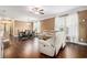 Open-concept living space with hardwood floors, living room seating, and adjacent dining area at 189 Ella Kinley Circle # 201, Myrtle Beach, SC 29588