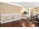 Open concept living area showing hardwood floors, built in cabinet and a partial view of the kitchen at 189 Ella Kinley Circle # 201, Myrtle Beach, SC 29588