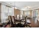 Open floor plan featuring dark wood floors, a dining area and tan sectional couch at 189 Ella Kinley Circle # 201, Myrtle Beach, SC 29588