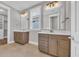 Bathroom with double vanity and modern lighting fixtures at 1936 Indigo Cove Ln, Calabash, NC 28467