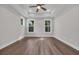 Spacious bedroom with tray ceiling and ceiling fan at 1936 Indigo Cove Ln, Calabash, NC 28467