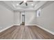 Neutral bedroom with a ceiling fan and large windows at 1936 Indigo Cove Ln, Calabash, NC 28467