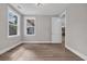 Bedroom with wood look flooring and light fixture at 1936 Indigo Cove Ln, Calabash, NC 28467