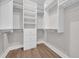 Custom closet design with shelves and hanging racks at 1936 Indigo Cove Ln, Calabash, NC 28467