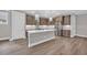 Modern kitchen featuring an island, stainless steel appliances, and sleek countertops at 1936 Indigo Cove Ln, Calabash, NC 28467