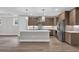 Modern kitchen featuring an island, stainless steel appliances, and sleek countertops at 1936 Indigo Cove Ln, Calabash, NC 28467