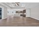 Spacious home with open floor plan and bright kitchen with island and stainless steel appliances at 1936 Indigo Cove Ln, Calabash, NC 28467