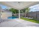 Inviting covered patio overlooking a sparkling pool and landscaped backyard at 1936 Indigo Cove Ln, Calabash, NC 28467