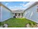 A beautiful backyard features a well-maintained lawn with patio furniture and barbecue, perfect for outdoor gatherings and relaxation at 1940 Indigo Cove Ln, Calabash, NC 28467
