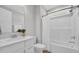Clean bathroom featuring a shower-tub combo, white vanity, and modern fixtures at 1940 Indigo Cove Ln, Calabash, NC 28467