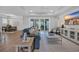 Bright and airy living room featuring modern furniture, recessed lighting, and sliding glass doors to the backyard at 1940 Indigo Cove Ln, Calabash, NC 28467