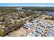 This is an aerial view of a neighborhood near a marsh with a winding river at 1946 Indigo Cove Ln, Calabash, NC 28467