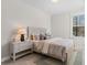 Comfortable bedroom with carpet, light wood furnishings, and a view from the window at 1946 Indigo Cove Ln, Calabash, NC 28467