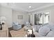Inviting living room features hardwood floors, neutral tones, and sliding doors to the patio at 1946 Indigo Cove Ln, Calabash, NC 28467
