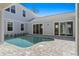 This backyard features a pool, beautiful patio, and manicured landscaping at 1946 Indigo Cove Ln, Calabash, NC 28467