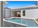 This backyard features an in-ground pool, patio, and well-maintained landscaping at 1946 Indigo Cove Ln, Calabash, NC 28467