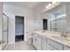 Bathroom features a double sink vanity, large mirrors, and a glass enclosed shower at 200 Lister St, Conway, SC 29526