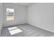 Bright bedroom with plush gray carpet, natural light, and neutral walls providing a peaceful ambiance at 200 Lister St, Conway, SC 29526