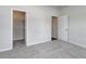 Clean bedroom features plush gray carpet and an open closet for convenient storage at 200 Lister St, Conway, SC 29526