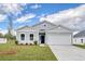 Attractive single-story home with a two-car garage, lush lawn, and landscaped front yard at 200 Lister St, Conway, SC 29526