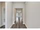 Bright hallway featuring stylish hard floors, neutral walls, and an open view to the living area at 200 Lister St, Conway, SC 29526