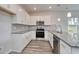 Modern kitchen featuring white cabinets, granite countertops and stainless steel appliances at 200 Lister St, Conway, SC 29526