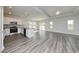 Spacious open floor plan with hardwood floors, granite countertops and modern kitchen appliances at 200 Lister St, Conway, SC 29526