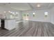 Bright, open-concept living room featuring hardwood floors and large sliding glass doors to backyard at 200 Lister St, Conway, SC 29526