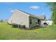 View of the home's green backyard, white fence, and outdoor patio area at 2016 Willow Run Dr. # B, Little River, SC 29566