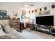 Bedroom with desk, TV, and lots of sports decor at 2016 Willow Run Dr. # B, Little River, SC 29566