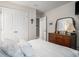 Serene bedroom featuring a well-lit space with a full-size bed, double closets, and stylish dresser at 2016 Willow Run Dr. # B, Little River, SC 29566