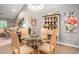 Bright dining area with stylish table and chandelier, perfect for Gathering meals at 2016 Willow Run Dr. # B, Little River, SC 29566
