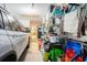 Organized garage space with a car, shelving, and various storage containers for household items at 2016 Willow Run Dr. # B, Little River, SC 29566